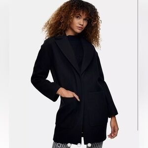 Tom Kleiner’s Vintage black wool coat with shoulder pads